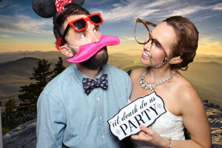 Fun loving image of bride and guest from a wedding photo booth